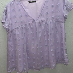 purple short sleeve shirt with ruffles